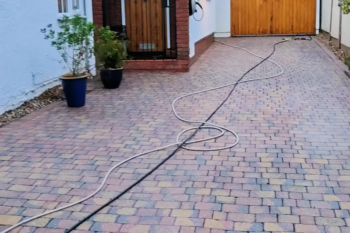 Driveway before professional algae treatment by Exact Clean