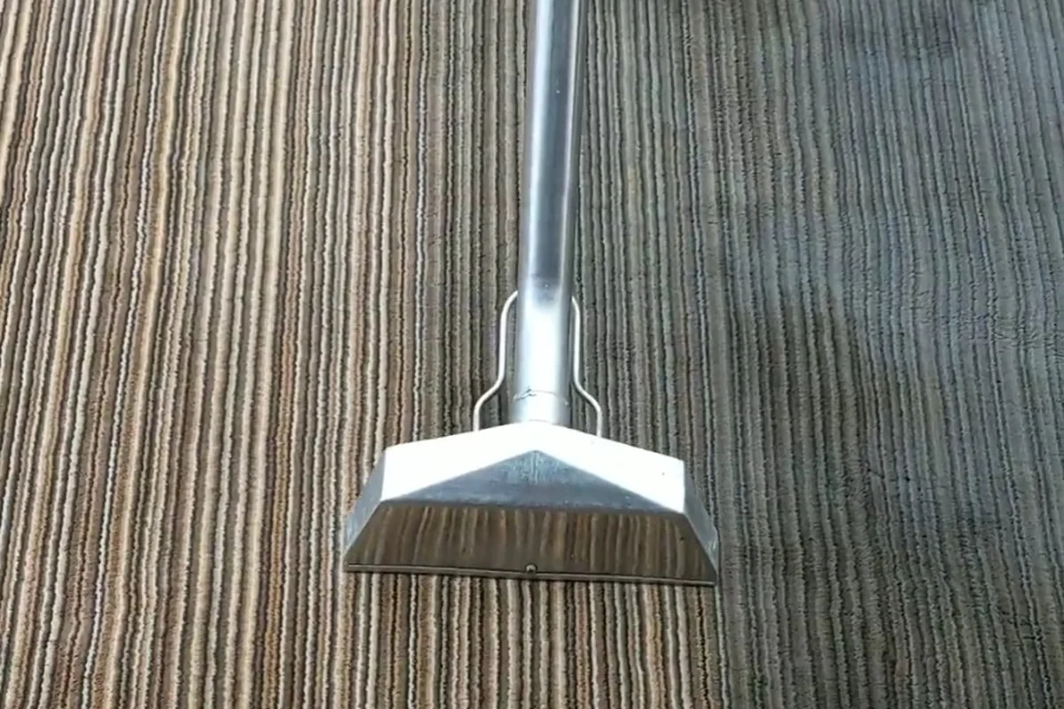 Commercial carpet cleaning in progress by Exact Clean showing professional extraction cleaning