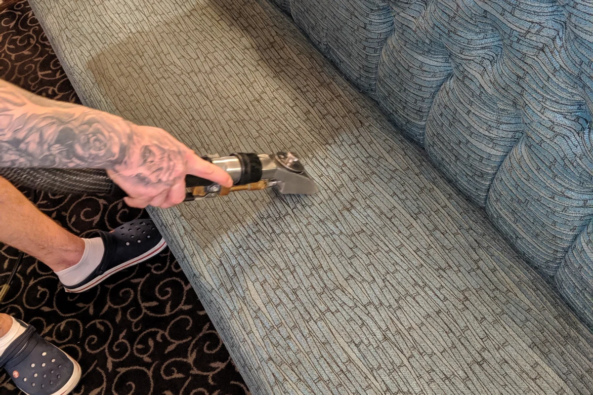 Commercial upholstery cleaning in progress by Exact Clean