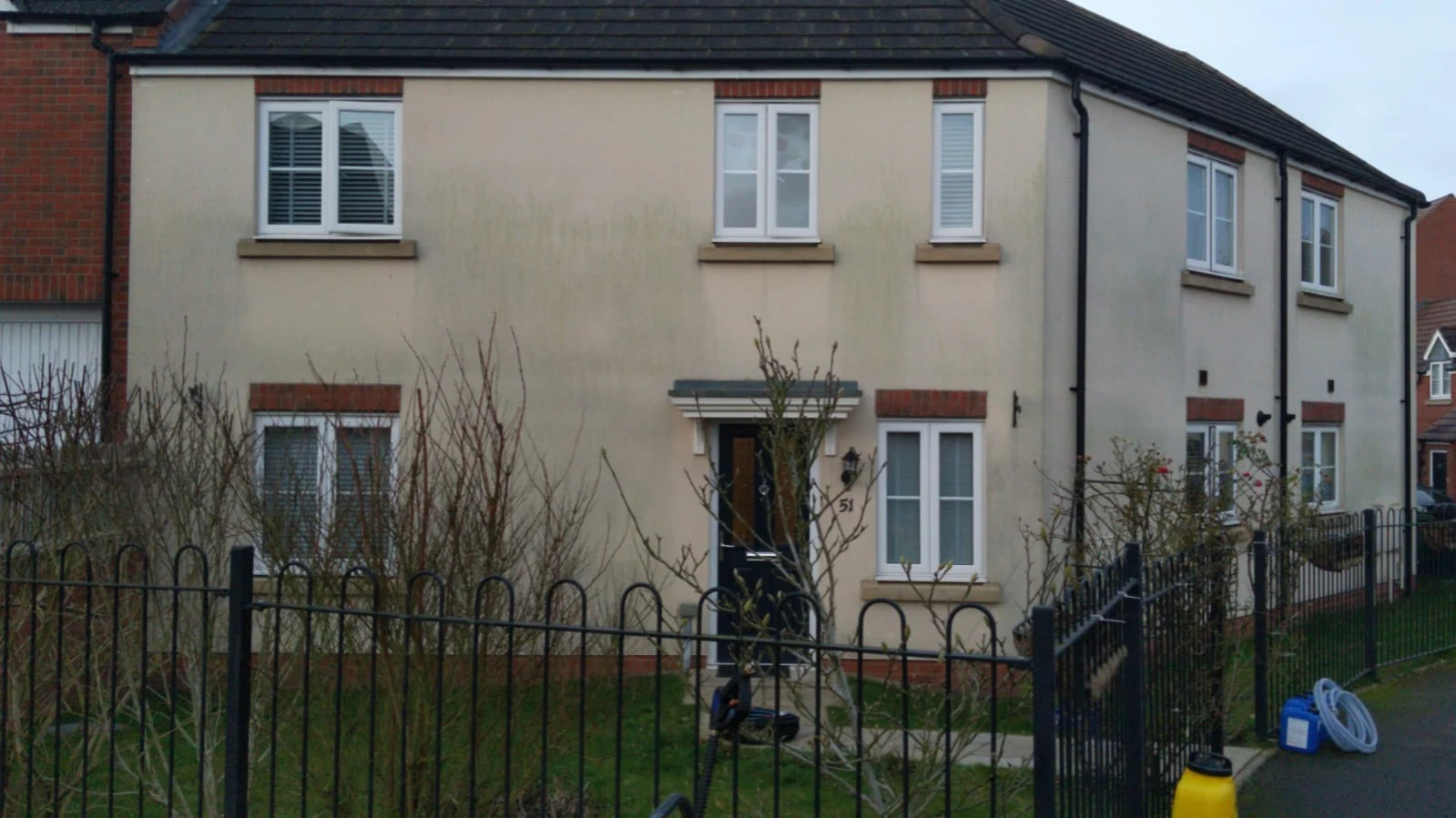 Exterior wall before professional cleaning