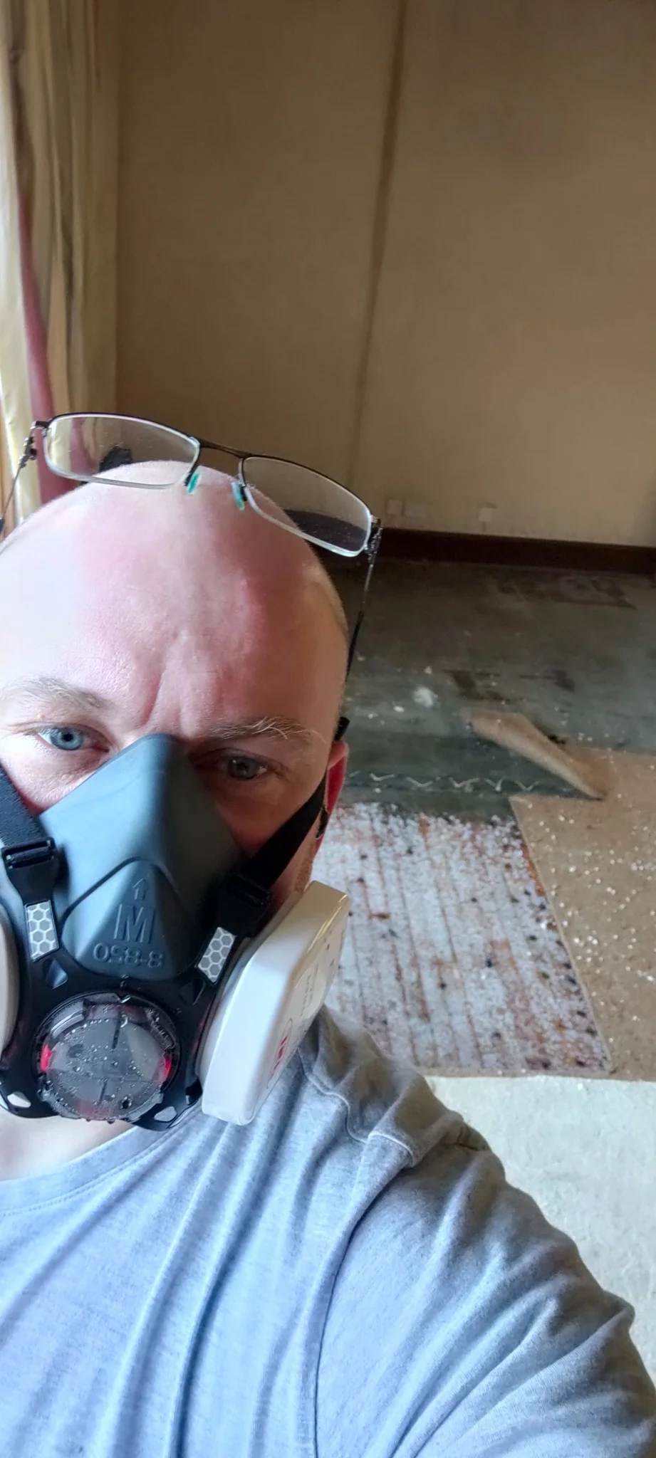 Exact Clean technician wearing respiratory protection during a flood damage job