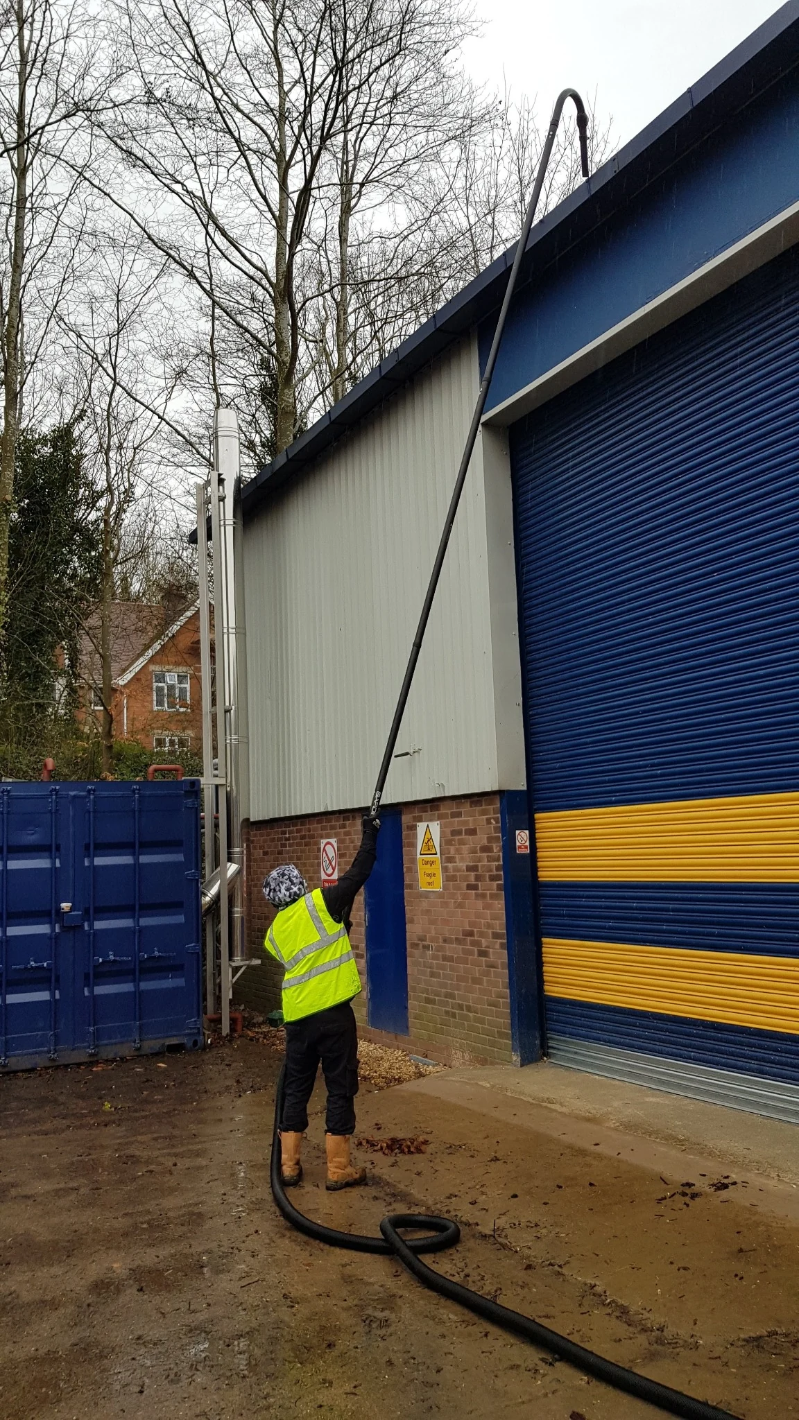 Exact Clean carrying out commercial gutter cleaning at height